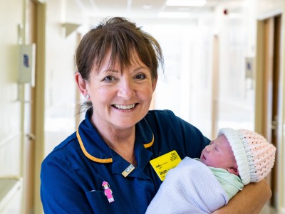 Joan Midwife with baby.jpg